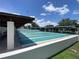 Enjoy the community shuffleboard courts on a sunny day under partly cloudy skies at 164 Royal Palm Dr, Leesburg, FL 34748