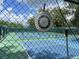 Community tennis court temperature gauge on a fence at 164 Royal Palm Dr, Leesburg, FL 34748