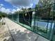 Community tennis court sign on the fence at 164 Royal Palm Dr, Leesburg, FL 34748