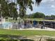 Waterfront view offering picnic tables, umbrellas, and a boat dock at 164 Royal Palm Dr, Leesburg, FL 34748