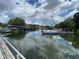 Enjoy waterfront living with access to boat docks and scenic views, creating a serene atmosphere at 164 Royal Palm Dr, Leesburg, FL 34748