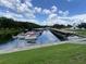 Scenic waterfront community with covered boat slips, offering a serene escape for residents at 164 Royal Palm Dr, Leesburg, FL 34748