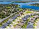 Aerial view showcasing the community, lake, and the location of a beautiful home with well-maintained landscaping at 17290 Hickory Wind Dr, Clermont, FL 34711