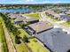Gorgeous aerial view of a home with screened-in pool, lush landscaping, and a lake view in a desirable community at 17290 Hickory Wind Dr, Clermont, FL 34711