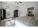 Spacious bedroom with abundant natural light, ceiling fan, and ensuite bath at 17290 Hickory Wind Dr, Clermont, FL 34711