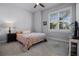 Cozy bedroom featuring a comfortable bed, shuttered window, and a calming, neutral color scheme at 17290 Hickory Wind Dr, Clermont, FL 34711