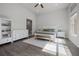 Bedroom features a king bed, side tables, and storage, illuminated by natural light at 17290 Hickory Wind Dr, Clermont, FL 34711