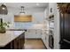 Gourmet kitchen featuring white cabinetry, stainless appliances, and a view from the window at 17290 Hickory Wind Dr, Clermont, FL 34711