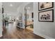 Open-concept living space with hardwood floors and plenty of natural light at 17290 Hickory Wind Dr, Clermont, FL 34711