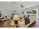 Inviting living room with plush seating, a backyard view, and contemporary decor at 17290 Hickory Wind Dr, Clermont, FL 34711
