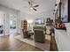 Comfortable sitting room featuring sleek hardwood flooring, a ceiling fan and a variety of decor at 17290 Hickory Wind Dr, Clermont, FL 34711