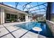 Gorgeous pool and patio area offers a perfect retreat for soaking up the sun and entertaining guests at 17290 Hickory Wind Dr, Clermont, FL 34711