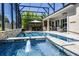Enjoy this screened-in pool area, ideal for relaxing and entertaining with an outdoor kitchen at 17290 Hickory Wind Dr, Clermont, FL 34711