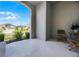 Inviting front porch features comfortable seating and a tranquil view of the surrounding neighborhood at 17290 Hickory Wind Dr, Clermont, FL 34711