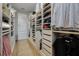 Large walk-in closet featuring custom organizers and plenty of storage for clothes and accessories at 17290 Hickory Wind Dr, Clermont, FL 34711