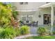 Landscaped back patio featuring garden area and outdoor seating, perfect for relaxation and entertaining at 1785 Rushden Dr, Ocoee, FL 34761