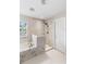 Bathroom features a marble tiled soaking tub and shower with a bronze showerhead at 1785 Rushden Dr, Ocoee, FL 34761