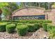 Elegant brick community sign with lush landscaping and manicured shrubs at 1785 Rushden Dr, Ocoee, FL 34761