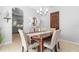 Charming dining area featuring a modern chandelier, dining table, and elegant decor enhancing the ambiance at 1785 Rushden Dr, Ocoee, FL 34761