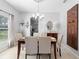 Formal dining room with elegant chandelier and decor, creating a sophisticated ambiance for gatherings and meals at 1785 Rushden Dr, Ocoee, FL 34761