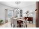 Inviting dining room featuring tile floors, natural light, and traditional décor at 1785 Rushden Dr, Ocoee, FL 34761