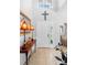 Inviting foyer with tile flooring, a console table, and decor enhancing the home's welcoming atmosphere at 1785 Rushden Dr, Ocoee, FL 34761