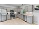Well-lit kitchen with stainless steel appliances and gray cabinets at 1785 Rushden Dr, Ocoee, FL 34761