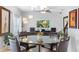 Modern living room and dining area with textured wall and contemporary decor at 1785 Rushden Dr, Ocoee, FL 34761