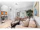 Inviting living room with comfortable seating, large windows, and stylish decor creating a cozy and bright atmosphere at 1785 Rushden Dr, Ocoee, FL 34761