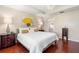 Bright bedroom with hardwood floors, a tray ceiling, and soft, neutral paint at 1785 Rushden Dr, Ocoee, FL 34761
