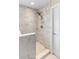 This marble shower includes mosaic tile flooring and bronze shower head at 1785 Rushden Dr, Ocoee, FL 34761