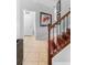 Beautiful wood staircase with iron railing and neutral walls adorned with framed art at 1785 Rushden Dr, Ocoee, FL 34761