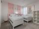 Bedroom with two twin beds and a lion-themed artwork on the wall at 1811 Caribbean View Ter, Kissimmee, FL 34747
