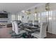 Elegant dining room with modern lighting, seating for six, and sliding glass doors to the patio at 1811 Caribbean View Ter, Kissimmee, FL 34747