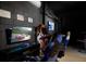 Fun game room with a racing theme, arcade games, and comfortable seating at 1811 Caribbean View Ter, Kissimmee, FL 34747