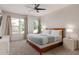 Tranquil main bedroom with two windows, soft lighting, and an inviting king-size bed at 1811 Caribbean View Ter, Kissimmee, FL 34747