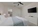 Comfortable main bedroom with a king bed, large windows, and access to the en-suite bathroom at 1811 Caribbean View Ter, Kissimmee, FL 34747