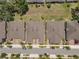 Overhead shot displaying similar houses in a neatly organized neighborhood, showcasing their roof lines and driveways at 1841 Overcup Ave, St Cloud, FL 34769
