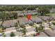 Aerial view of a beautiful residential home in a lush community with mature trees and well-kept landscaping at 1841 Overcup Ave, St Cloud, FL 34769