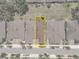 Aerial view highlighting the property boundaries amidst a neighborhood with neatly arranged houses and driveways at 1841 Overcup Ave, St Cloud, FL 34769
