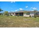 Spacious backyard featuring a screened-in patio perfect for outdoor relaxation and entertaining at 1841 Overcup Ave, St Cloud, FL 34769