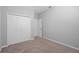 Simple bedroom with carpet, closet, white trim, and neutral color palette at 1841 Overcup Ave, St Cloud, FL 34769