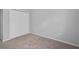 Carpeted bedroom with white trim and a closet at 1841 Overcup Ave, St Cloud, FL 34769