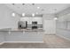 Bright kitchen featuring stainless steel appliances, granite countertops, ample cabinet space and tiled floors at 1841 Overcup Ave, St Cloud, FL 34769