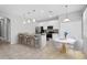 Modern kitchen with stainless steel appliances, granite countertops, breakfast bar, and an adjacent dining area at 1841 Overcup Ave, St Cloud, FL 34769