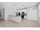 Modern kitchen featuring stainless steel appliances, granite countertops, and a breakfast bar at 1841 Overcup Ave, St Cloud, FL 34769