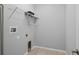 Functional laundry room with shelving and hookups for washer and dryer at 1841 Overcup Ave, St Cloud, FL 34769