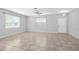 Bright room featuring large windows and neutral tile flooring at 1841 Overcup Ave, St Cloud, FL 34769