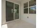 Outdoor patio area with sliding glass door and windows, creating a bright and inviting space at 1841 Overcup Ave, St Cloud, FL 34769