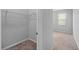 Spacious walk-in closet featuring ample storage with installed shelving and neutral carpeting at 1841 Overcup Ave, St Cloud, FL 34769